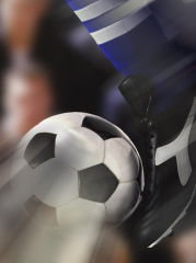Close-up of a Soccer Player Kicking a Soccer Ball