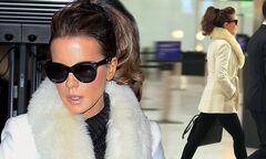 Kate Beckinsale wraps up in belted white coat with fur collar ...