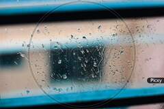 Image of Drops of rain on blue glass background. drops on glass ...