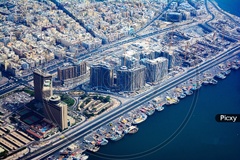 Image of Aerial View Of Dubai City With High Rise Buildings And ...