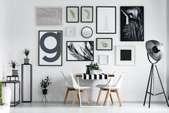 Black and white photo frames on a white wall