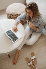 HD : woman in white and black striped dress shirt sitting ...