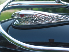 A close up of a car's hood ornament. Figurehead motorcycle summer ...