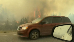 Residents flee as wildfire approaches capital of Canada's ...