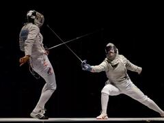 Duel of athletes with foil, epee and sword in fencing 2K ...