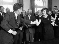 Eunice Shriver Receives a Signing Pen from Her Brother, President John Kennedy