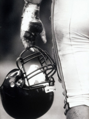 Low Angle View of An American Football Player Holding a Helmet