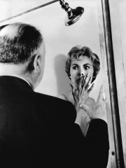 PSYCHO, 1960 directed by ALFRED HITCHCOCK On the set, Alfred Hitchcock directs Janet Leigh (b/w pho
